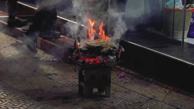 Sacrifice Of Food On Fire During The Rite Of Challa Offering Goddess Pachamama On The Street In Bolivia