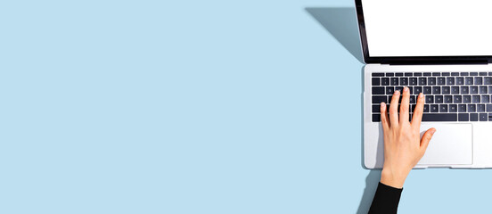 Person using a laptop computer from above