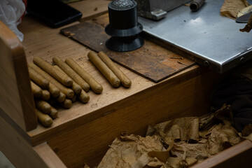 Handmade, high-quality Dominican cigars. The process of rolling tobacco leaves.