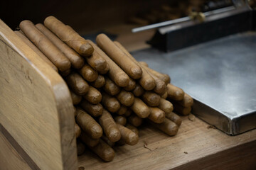 Handmade, high-quality Dominican cigars. The process of rolling tobacco leaves.