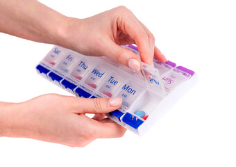 Woman hands opening pills box isolated on white background. Tablets and vitamins use for disease treatment and cure. High quality photo