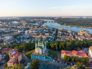Fototapeta na wymiar Saint Andrew's church and Andreevska street from above. Aerial drone view. Kyiv, Ukraine.