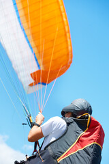 The sky is his playground. Shot of a man paragliding on a sunny day.