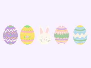 huevos de pascua de diferentes colores con motivos dibujados en ellos y el conejo de pascua en medio