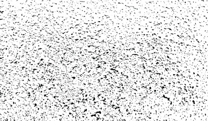 Small uneven spots and particles of debris. Abstract vector texture. Distressed uneven background. Grunge texture overlay with fine grains isolated on white background. Vector illustration. EPS10.