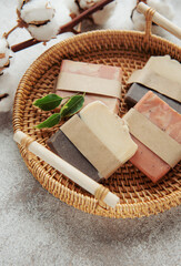 Handmade soap bars and green leaves