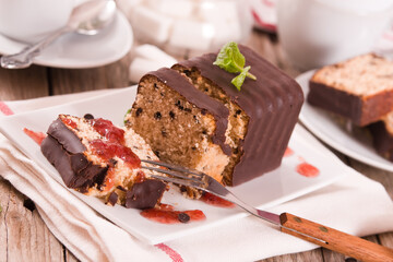 Fototapeta na wymiar Sponge cake with chocolate frosting.