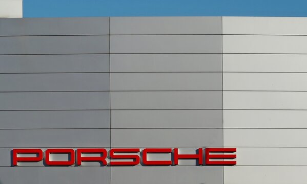 Tavagnacco, Italy. May 2, 2019. Porsche brand name on the facade of the official car dealership.