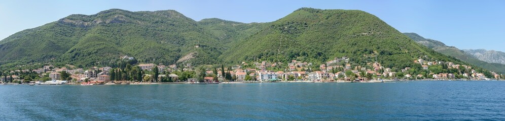 Fototapeta na wymiar View towards Bijela and Baošići from water of bay, Montenegro.