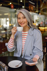 Urban woman during coffee time in cafe