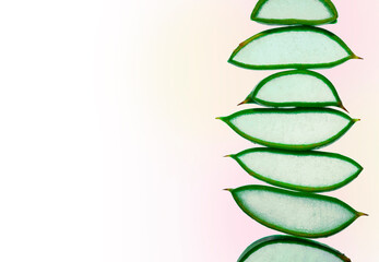 Aloe vera textured slices with sparking water or gel on white background