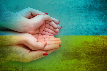 Stop the war in Ukraine. hands prays against the background of the flag of Ukraine, War in Ukraine,...