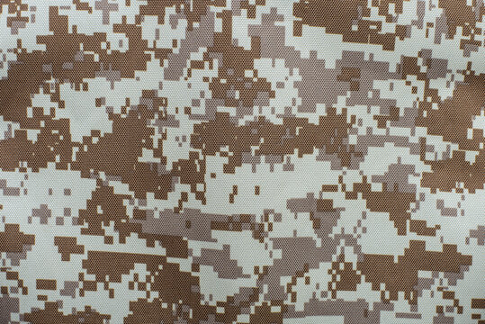 Fabric with a background of a soldier's military uniform, protective fabric for military shelter, close up