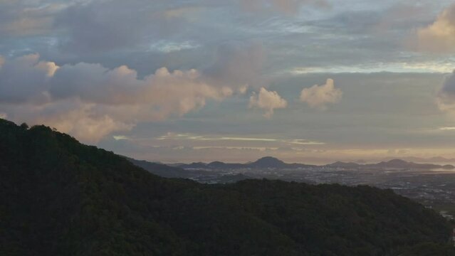 .aerial view beautiful yellow sunrise above archipelago Phuket..beautiful moving cloud in golden sky at sunrise..4k stock footage video in travel concept.