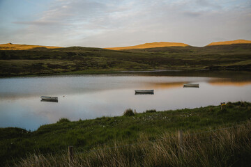 Sun on hill over the water