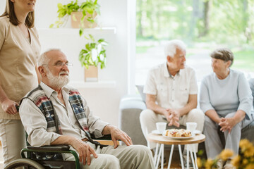 Senior people during afternoon in the nursing home living room - obrazy, fototapety, plakaty