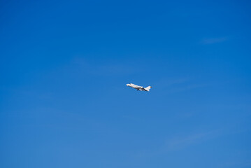 White private jet taking off from Zürich Airport on a sunny winter day. Photo taken February 13th, 2022, Zurich, Switzerland.