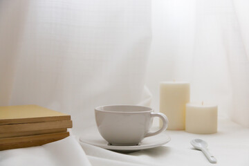White cup and candle mockup