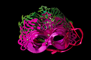 Multicolored carnival mask on black background.