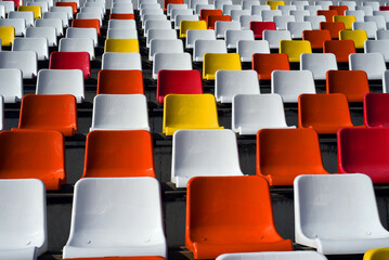 Fototapeta premium Rows of empty colorful plastic seats in a stadium. Beautiful! 