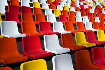 Fototapeta premium Rows of empty colorful plastic seats in a stadium. Beautiful! 