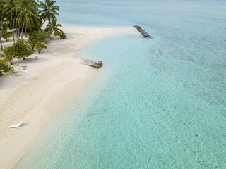 Maldive, white sand beach and transparent sea.