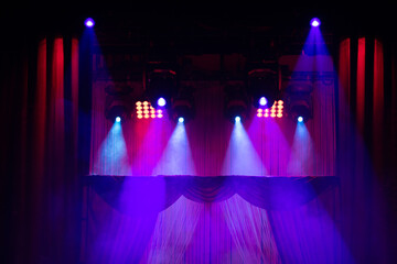 Сoncert on scene theater, stage light with colored spotlights and smoke.