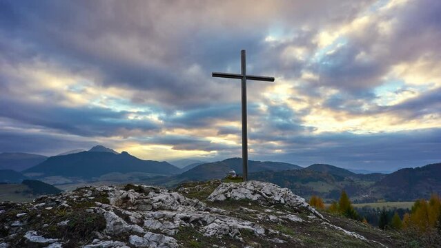 Christian Cross On A Rock At Sunset , Colourfull clouds.