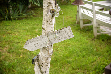 Soft focus vintage wedding sign. Handmade wooden board with the inscription Wedding