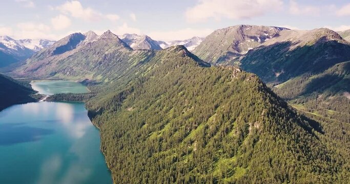 Panoramic aerial morning view of famous natural attraction of Altai and Russia - the Multa mountain lake at sunrise. National park and outdoor recreation background