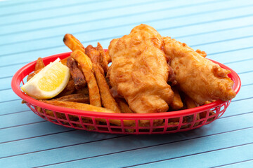 Fish and Chips on a Blue Wood Table a Classic Meal