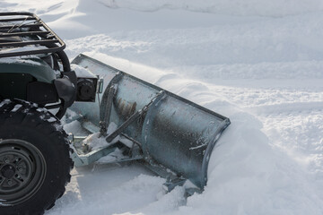 plowing snow with atv © Robert Fjällborg 
