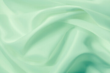 Fototapeta na wymiar Cosmetic silky cream texture green background