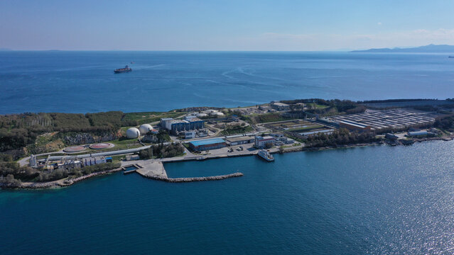 Aerial drone bird's eye view photo from island of Psitaleia the largest sewage treatment plant in Europe, Saronic gulf, Peiraeus, Attica, Greece