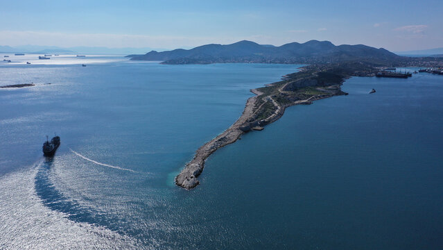 Aerial drone photo of iconic peninsula of Kinosoura or dog's tail in industrial part of island of Salamina, Saronic gulf, Greece