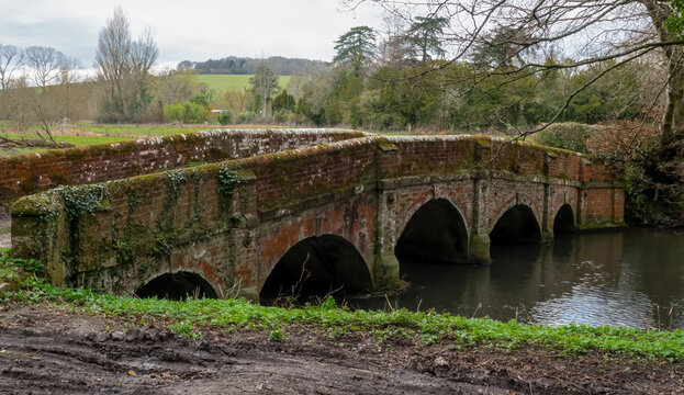 historic 5 arch red brick bridge over the river avon in Wiltshire UK