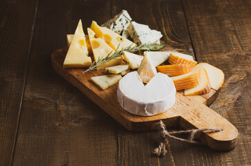 Various types of cheese with empty space background concept, copy space