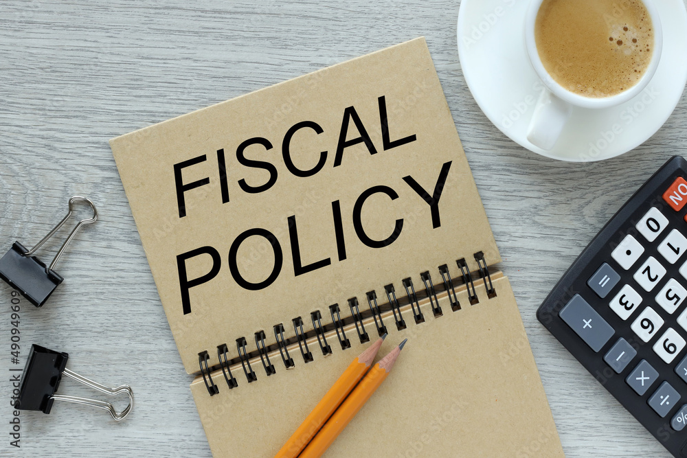 Aufkleber open notebook with a spring on a gray table. text on notebook. fiscal policy