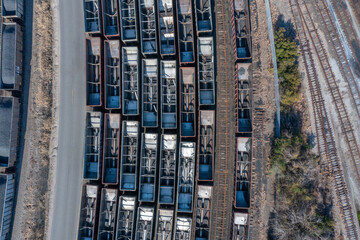 Aerial View top down of rail cars in a busy train yard