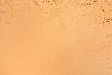 Bronzer or compact powder beige nude textured background
