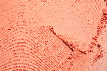 Blusher pink orange or pressed powder textured background
