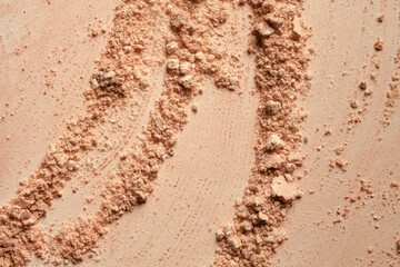 Bronzer or compact powder beige nude textured background