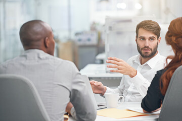 Great ideas in the making. Shot of coworkers having a meeting at the office.