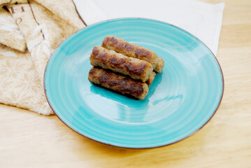 Cooked Breakfast Sausage Links Served on a Plate	
