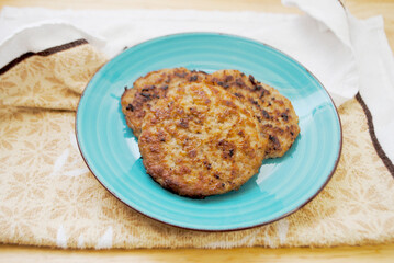 Round Breakfast Sausage Seved on a Small Plate	