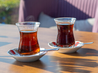Turkish tea and beautiful sunset on a outdoor cafe. Travel to Turkey concept