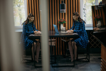 Young woman teacher conducts an online lesson. Distance learning and exam preparation.