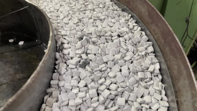 partial view of a trobalizing machine for mass deburring process, vibrating with ceramic chips or abrasive stones, removal of burrs from metal parts