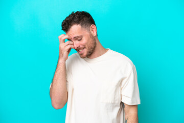 Fototapeta premium Young Brazilian man isolated on blue background laughing