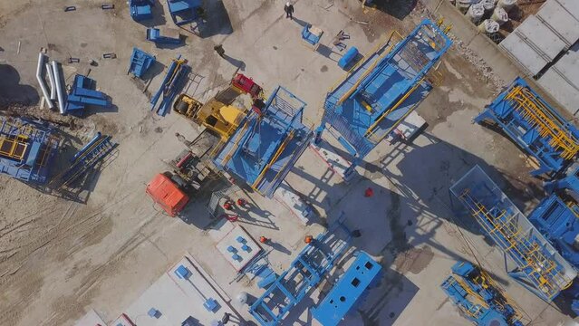 Modern industrial construction of a large industrial plant. View from the air. Construction crane, construction machinery.